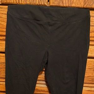 Black leggings with foot holder loop.